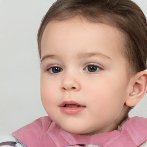 Joyful white child female with short  brown hair and brown eyes