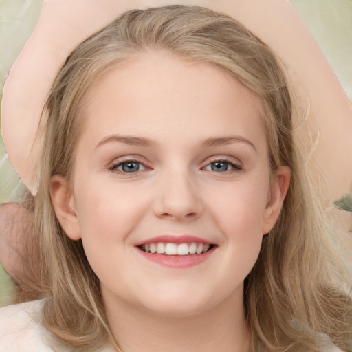 Joyful white child female with long  brown hair and brown eyes