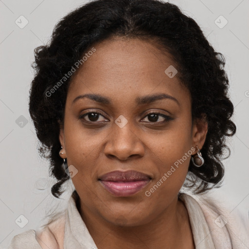 Joyful black young-adult female with long  brown hair and brown eyes