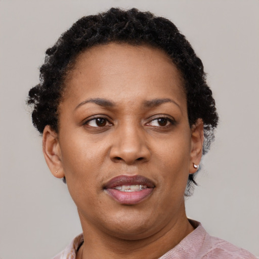Joyful latino adult female with short  brown hair and brown eyes