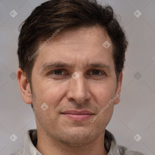 Joyful white adult male with short  brown hair and brown eyes