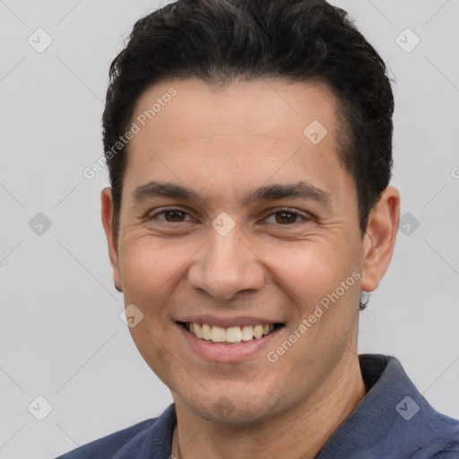 Joyful white young-adult male with short  black hair and brown eyes