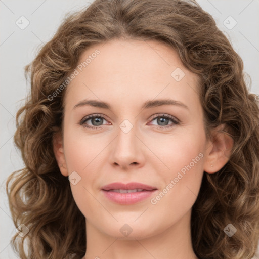 Joyful white young-adult female with long  brown hair and green eyes