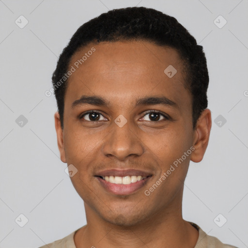 Joyful black young-adult male with short  black hair and brown eyes