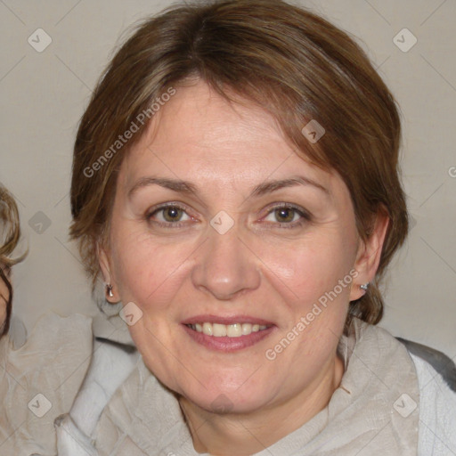 Joyful white adult female with medium  brown hair and blue eyes