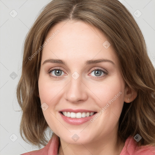 Joyful white young-adult female with long  brown hair and blue eyes