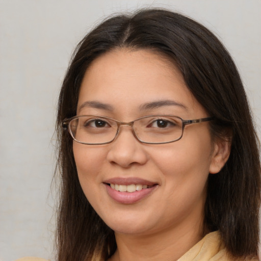 Joyful white adult female with medium  brown hair and brown eyes