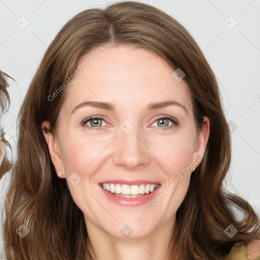 Joyful white young-adult female with long  brown hair and green eyes