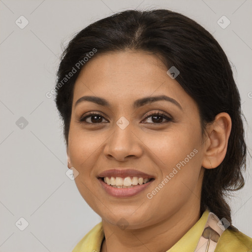 Joyful latino young-adult female with medium  brown hair and brown eyes