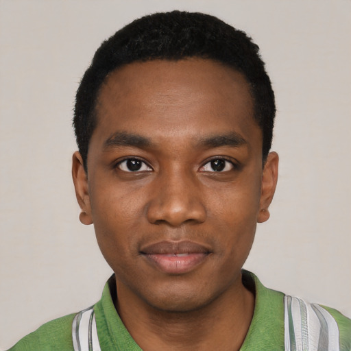 Joyful black young-adult male with short  black hair and brown eyes
