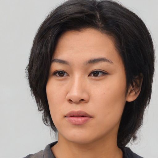 Neutral asian young-adult female with medium  brown hair and brown eyes