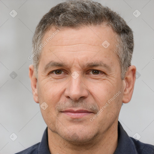 Joyful white middle-aged male with short  brown hair and brown eyes