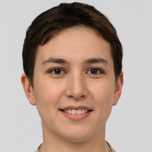 Joyful white young-adult female with short  brown hair and brown eyes