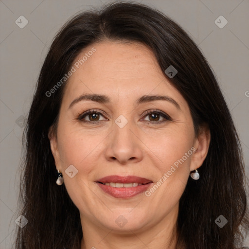 Joyful white adult female with long  brown hair and brown eyes