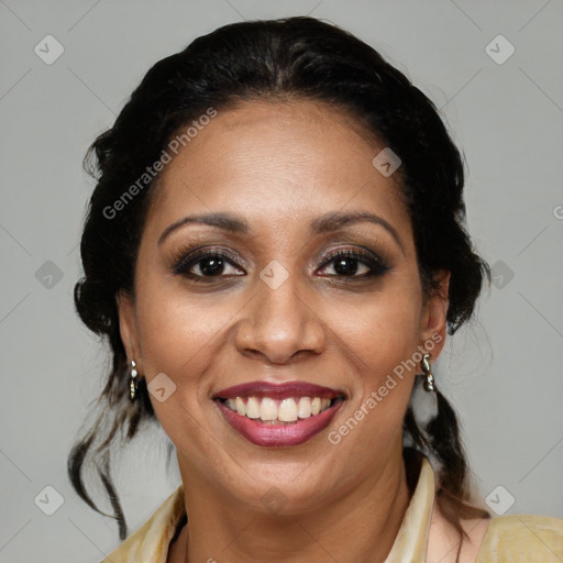 Joyful latino adult female with medium  brown hair and brown eyes