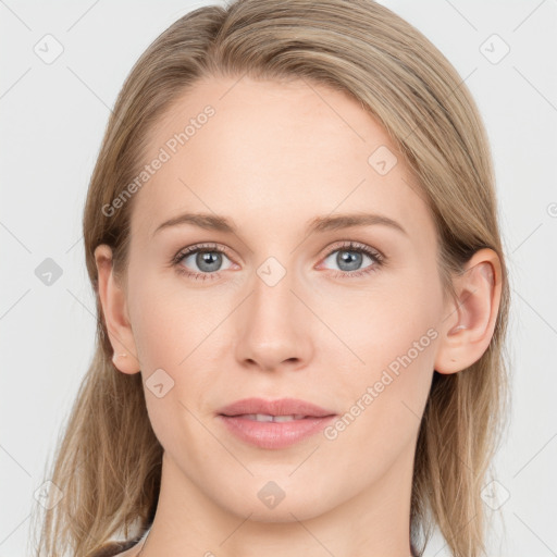 Joyful white young-adult female with long  brown hair and blue eyes