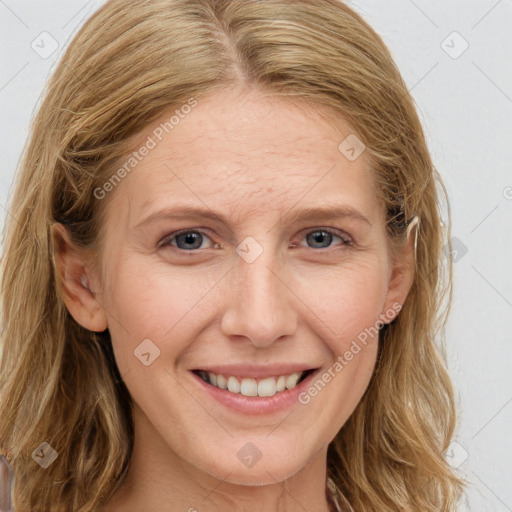 Joyful white young-adult female with long  brown hair and blue eyes