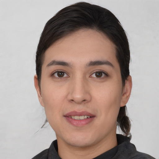 Joyful white young-adult female with short  black hair and brown eyes