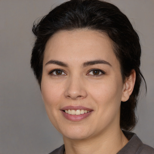 Joyful white young-adult female with medium  brown hair and brown eyes