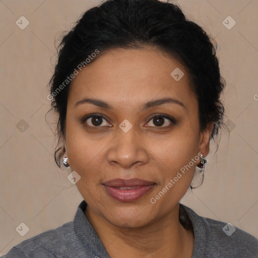 Joyful black adult female with medium  brown hair and brown eyes