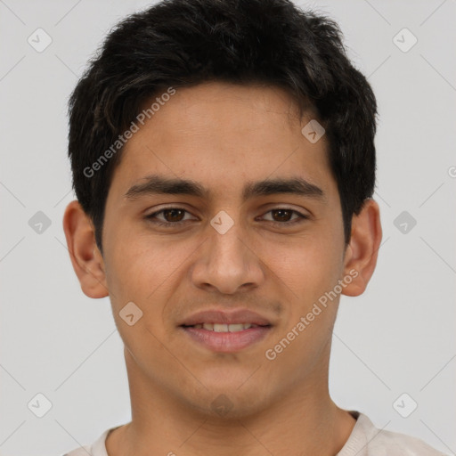 Joyful latino young-adult male with short  black hair and brown eyes