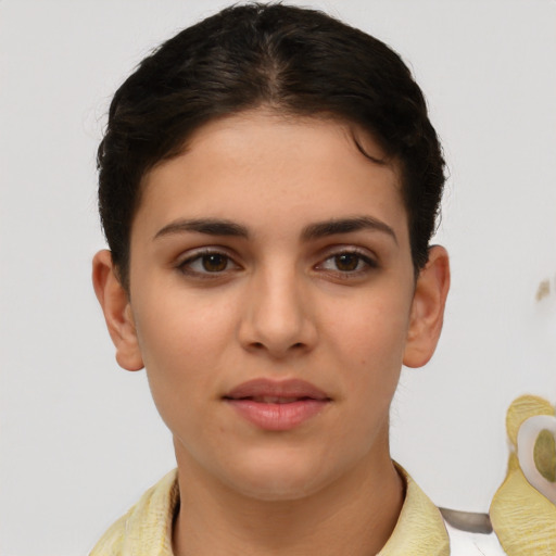 Joyful white young-adult female with short  brown hair and brown eyes