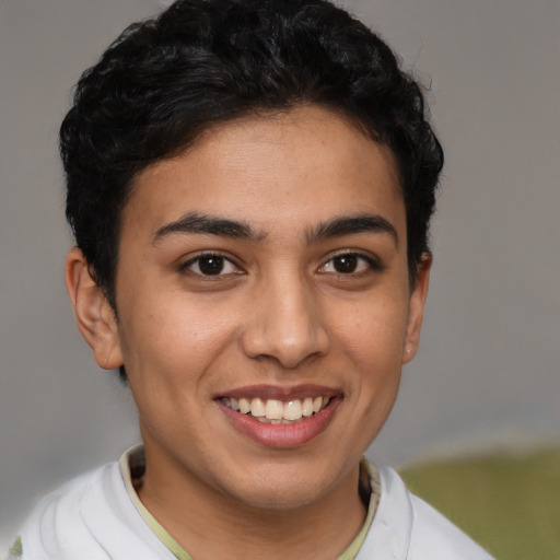 Joyful latino young-adult female with short  brown hair and brown eyes