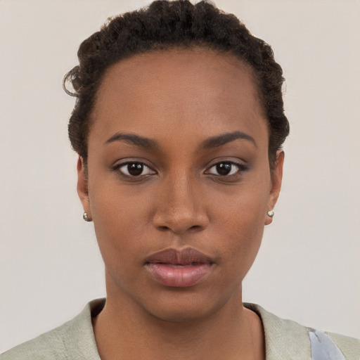 Neutral black young-adult female with short  brown hair and brown eyes