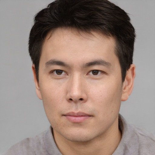 Neutral asian young-adult male with short  brown hair and brown eyes