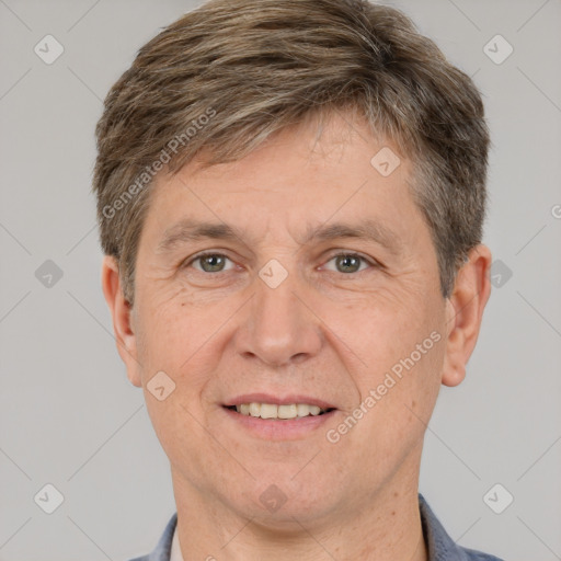 Joyful white adult male with short  brown hair and brown eyes