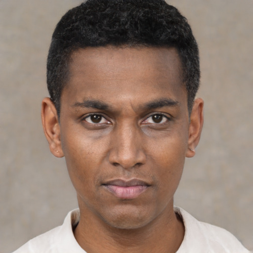 Neutral latino young-adult male with short  black hair and brown eyes