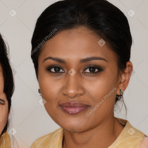 Joyful black young-adult female with medium  brown hair and brown eyes