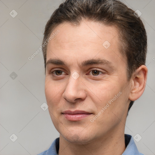 Joyful white adult male with short  brown hair and brown eyes