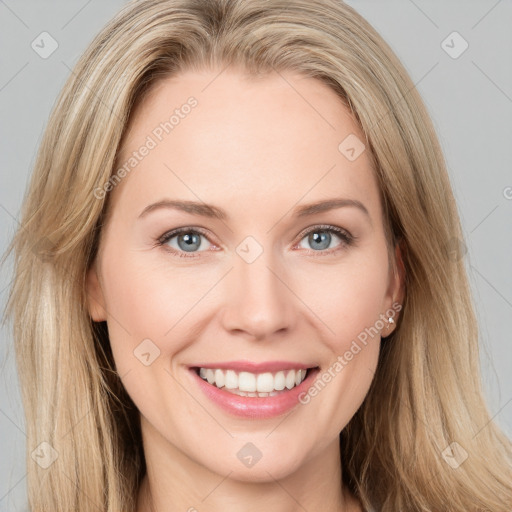 Joyful white young-adult female with long  brown hair and blue eyes