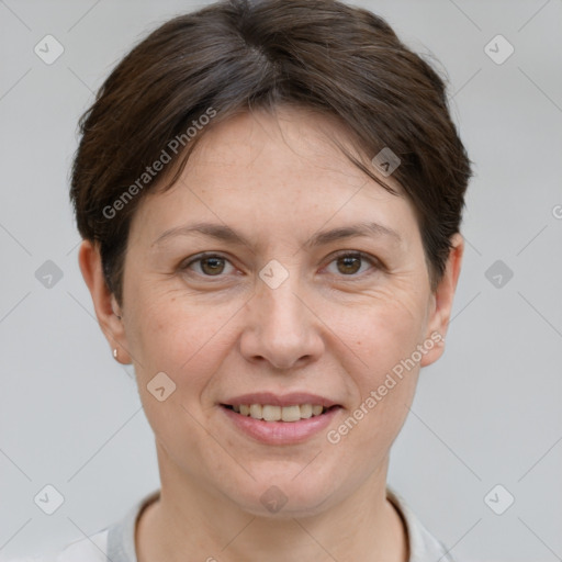 Joyful white adult female with short  brown hair and grey eyes