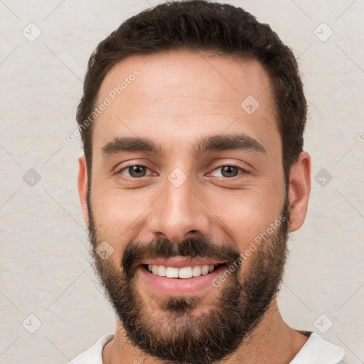 Joyful white young-adult male with short  brown hair and brown eyes