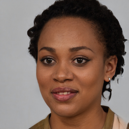 Joyful black young-adult female with short  brown hair and brown eyes