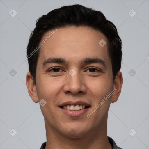 Joyful white young-adult male with short  black hair and brown eyes