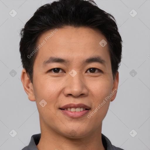 Joyful white young-adult male with short  black hair and brown eyes