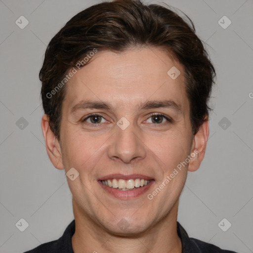 Joyful white adult male with short  brown hair and brown eyes