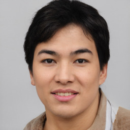 Joyful asian young-adult male with short  black hair and brown eyes