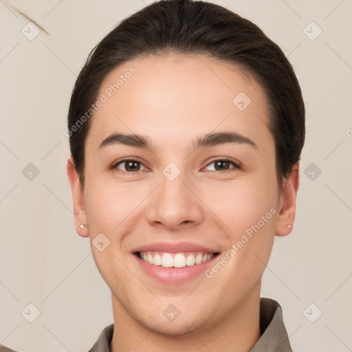 Joyful white young-adult female with short  brown hair and brown eyes