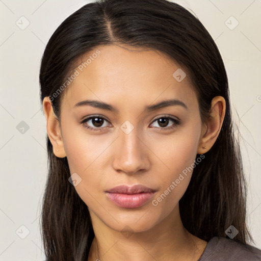 Joyful latino young-adult female with long  brown hair and brown eyes