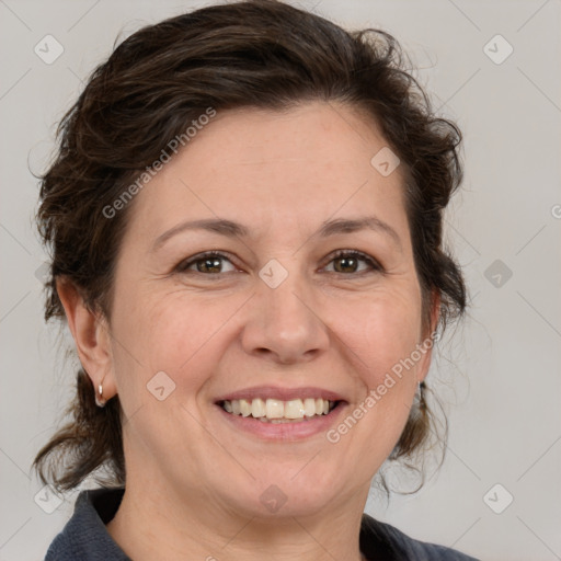 Joyful white adult female with medium  brown hair and grey eyes