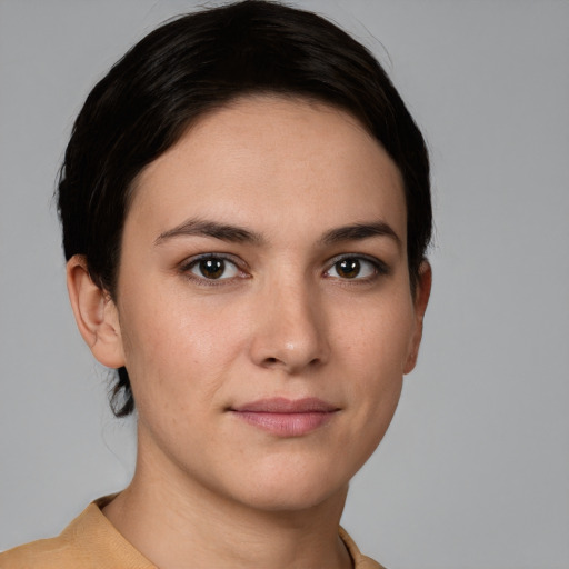 Joyful white young-adult female with short  brown hair and brown eyes