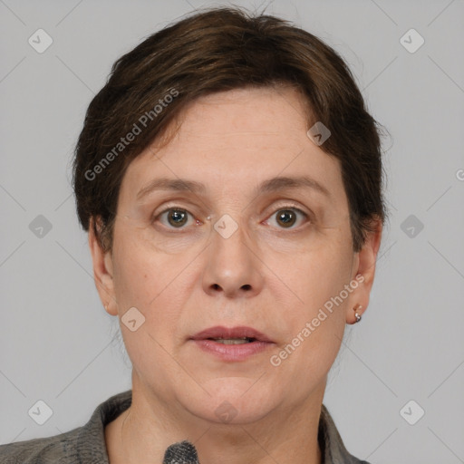 Joyful white adult female with short  brown hair and brown eyes