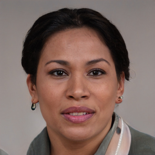Joyful asian adult female with short  brown hair and brown eyes