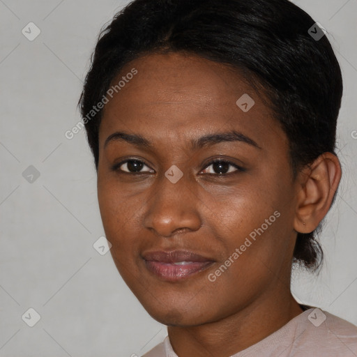 Joyful black young-adult female with short  brown hair and brown eyes