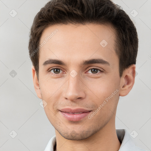 Joyful white young-adult male with short  brown hair and brown eyes