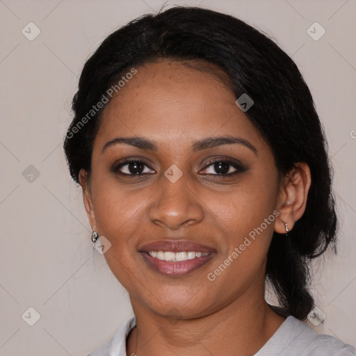 Joyful black young-adult female with medium  black hair and brown eyes